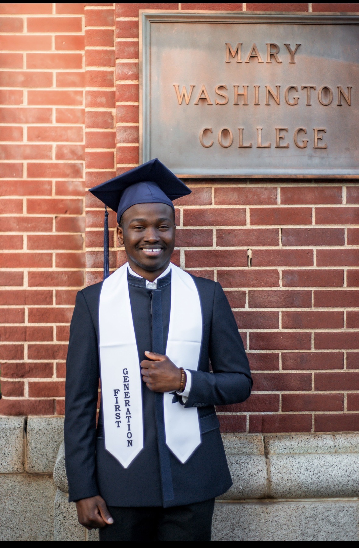 Aloysious Kabonge in cap and gown at his University of Mary Washington graduation